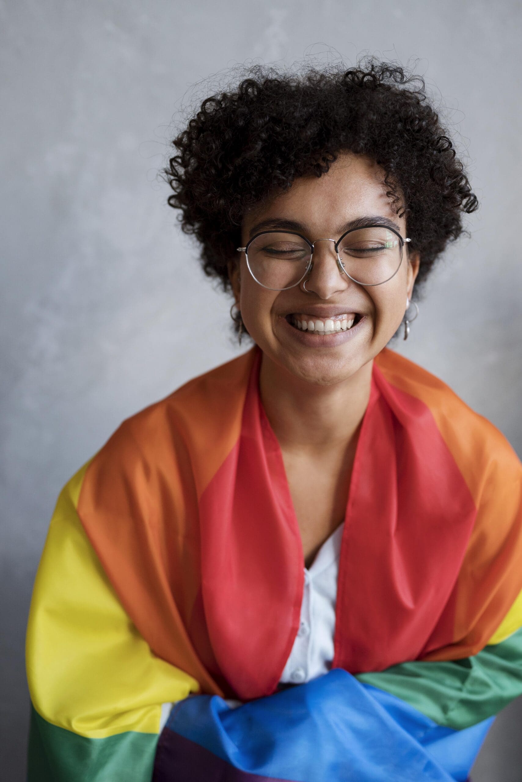 Young woman smiling and happy to not be engaging in perfectionist decision making