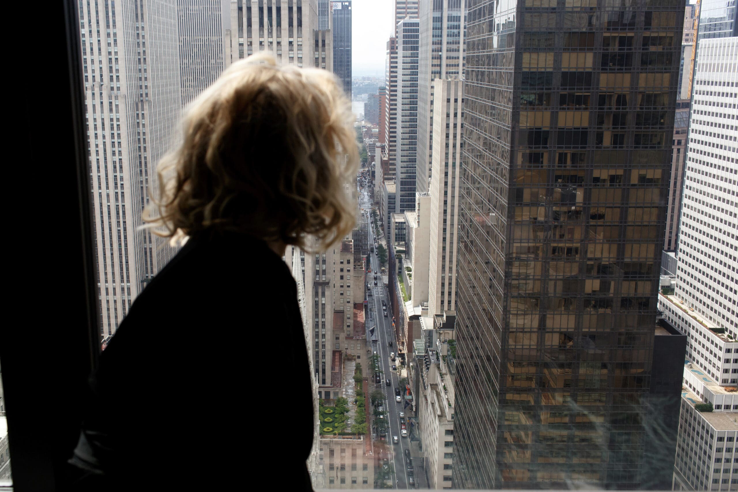 New Yorker looks out the window thinking about why she feels worse after therapy