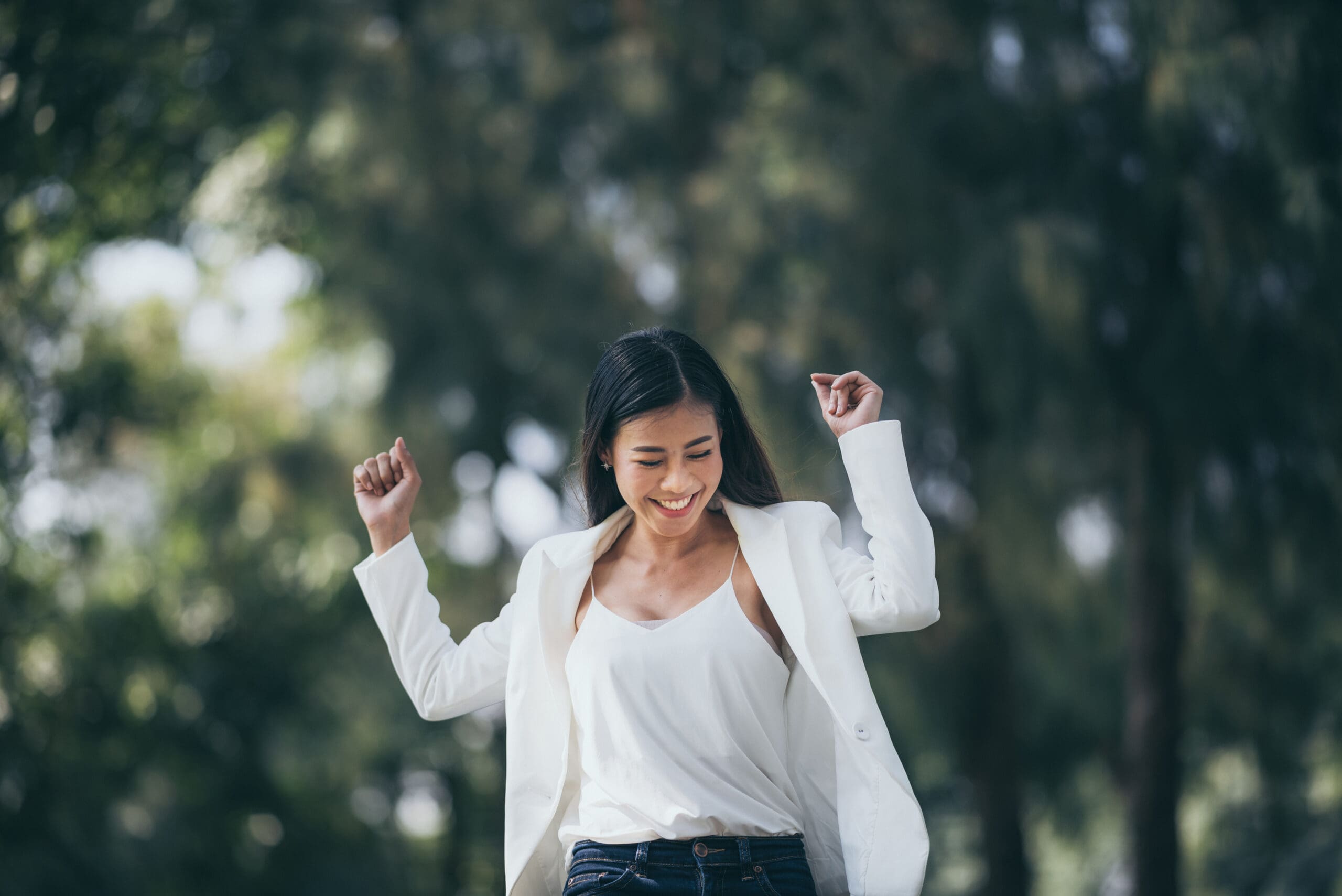 Woman smiling after making a big decision without regret during a life transition.