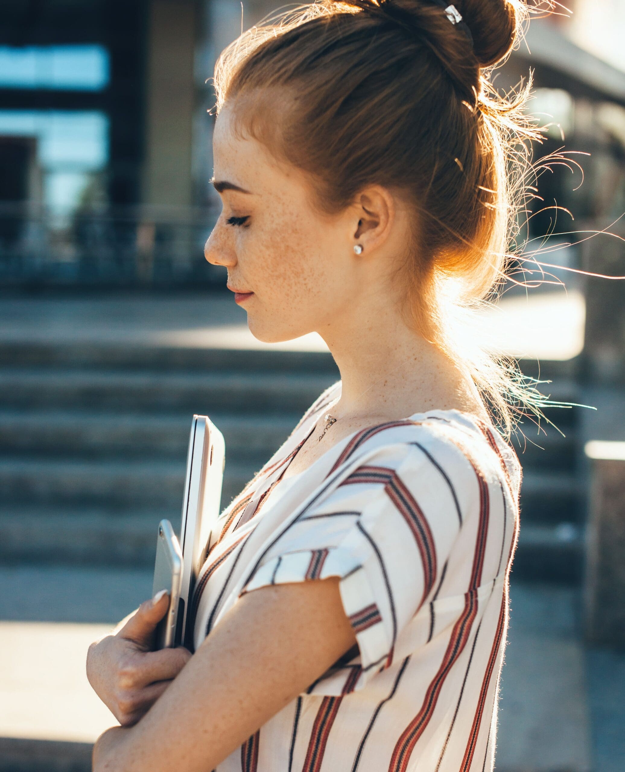 Young female walking with eyes closed, breaking the cycle of negative self-talk