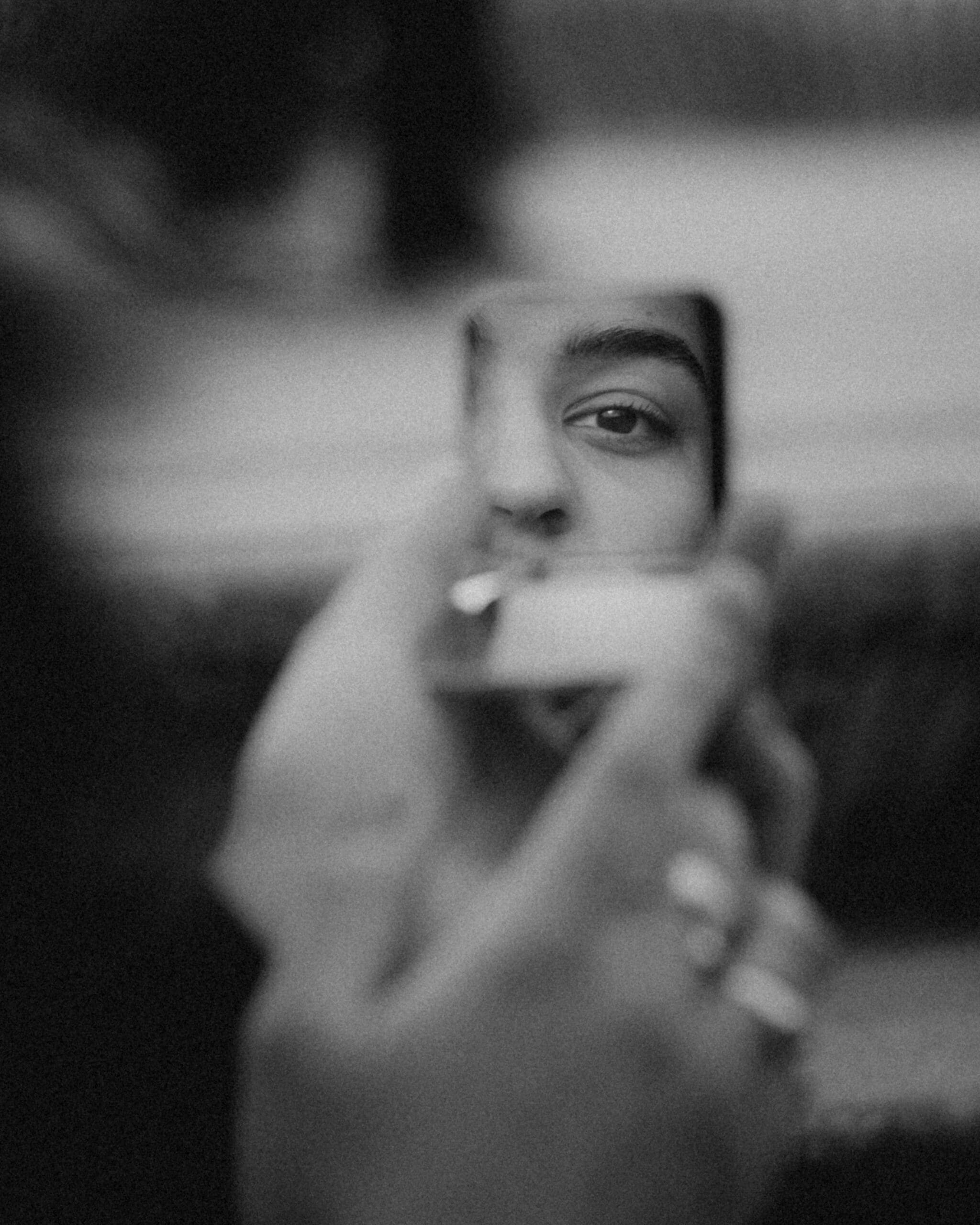 Woman looking at herself in the mirror, reflecting on if she has overfunctioning habits.